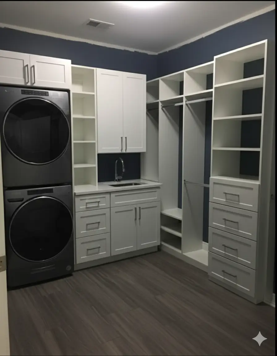 A clean, organized laundry room with white cabinets and a butcher block countertop